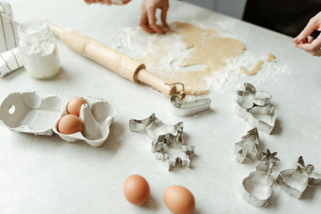 Cookie cutters and sugar cookie dough