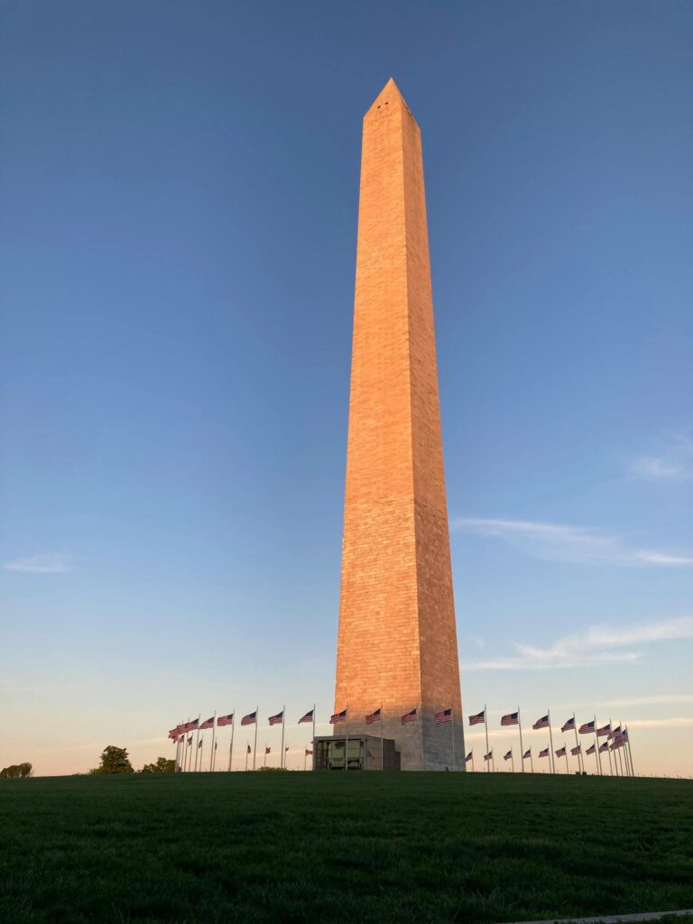 Washington Monument on the National Mall surrounded by American Flags