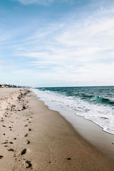 A peaceful stretch of sandy beach meeting the gentle waves.