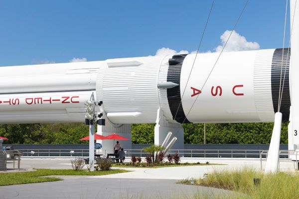 The rocket is part of an outdoor display, inviting curious visitors.