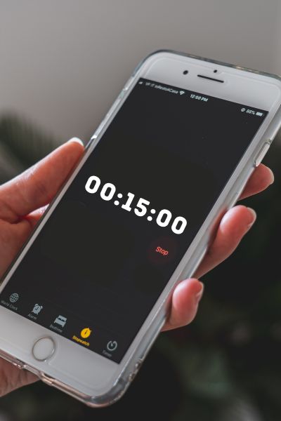 A countdown timer shows 15 minutes on a smartphone screen.