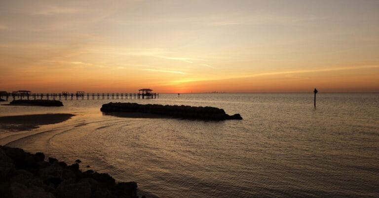 Evening light stretches across the water, bringing a moment to pause.