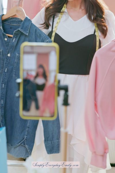 Woman selling clothes in an online live Whatnot auction